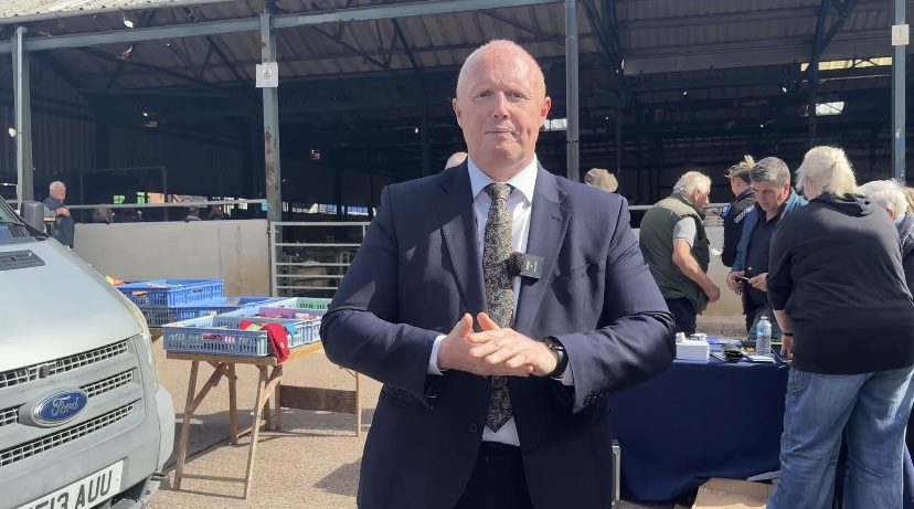 Deputy Commissioner Dave Evans standing at the cattle market