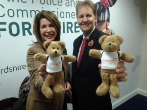 Deputy PCC Sue Arnold and PCC Matthew Ellis with Embrace CVOC 'backpack bears'