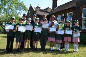 PCSO Elaine Sneyd, Insp Rachel Joyce, Head teacher Elizabeth Pearce, DPCC Sue Arnold, PCSO Danielle Brannan and Junior Police Cadets at Little Aston Primary School
